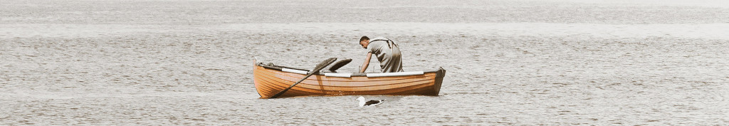 Image of man in a boat fishing cc0