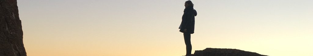 Image of a woman on a cliff edge cc0